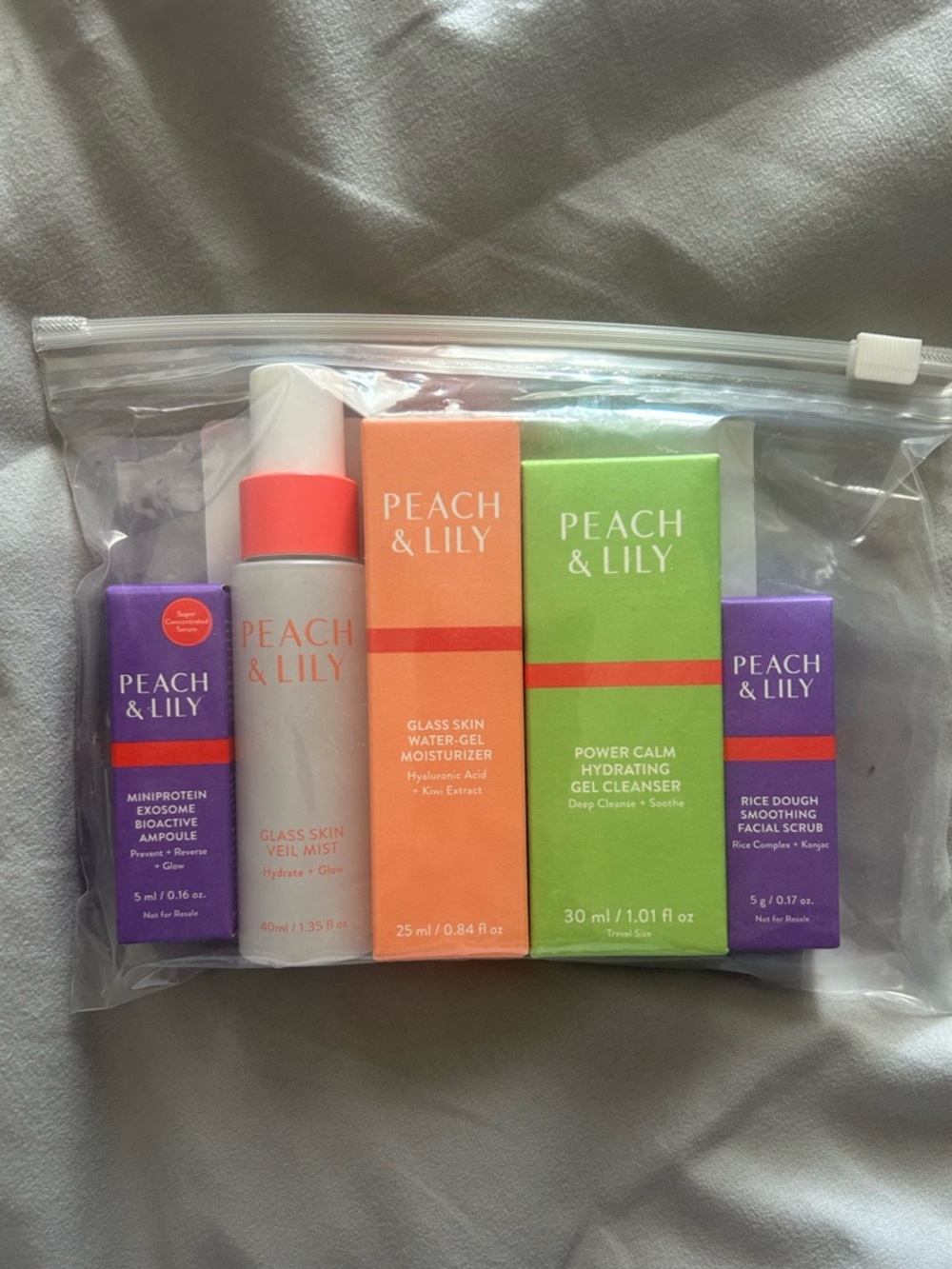 Peach & Lily 5 Piece Travel Skincare Glass Skin Moisturizer Cleanser Scrub
